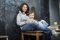 Young hipster teenage girl sitting with her brother in classroom multinational Royalty Free Stock Photo