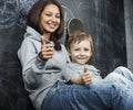 Young hipster teenage girl sitting with her brother in classroom multinational Royalty Free Stock Photo