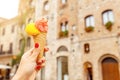 Hipster traveler eating ice-cream in old Italian town Royalty Free Stock Photo