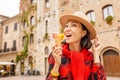 Hipster traveler eating ice-cream in old Italian town Royalty Free Stock Photo