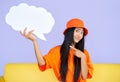 Young hipster woman holding empty speech bubble pointing her finger on it Royalty Free Stock Photo