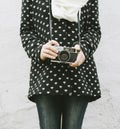 Young hipster woman holding vintage photo camera Royalty Free Stock Photo