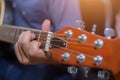 Close up of young hipster woman practiced guitar in the park,happy and enjoy playing guitar Royalty Free Stock Photo