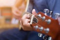 Close up of young hipster woman practiced guitar in the park,happy and enjoy playing guitar Royalty Free Stock Photo