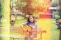 Close up of young hipster woman practiced guitar in the park,happy and enjoy playing guitar Royalty Free Stock Photo