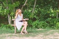 Young hipster woman reading a book has an idea pointing with fin Royalty Free Stock Photo