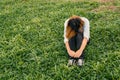 Young hipster woman, sad, long-haired sitting close her face an