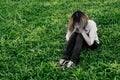 Young hipster woman, sad, long-haired sitting close her face an