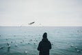 Young hipster woman standing by the sea Royalty Free Stock Photo