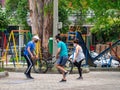 Young Hispanic Adults Wearing Face Masks Exercise Outdoor by Trees and Plants in Public Park