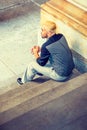 Young Hispanic American Man sitting on stairs Royalty Free Stock Photo