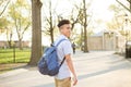 Young Hispanic boy with packpack walk on college campus Royalty Free Stock Photo