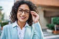 Young hispanic business woman wearing professional look smiling confident at the city Royalty Free Stock Photo