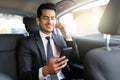 Businessman Listening Music In Car