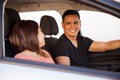 Young Hispanic couple in a car Royalty Free Stock Photo