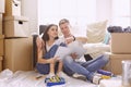 Young Hispanic couple looking at blueprints of new home, high angle view Royalty Free Stock Photo
