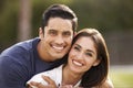 Young Hispanic couple looking to camera smiling, close up Royalty Free Stock Photo