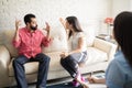 Couple quarreling in front of therapist