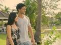 Young Hispanic couple relaxing in the park together Royalty Free Stock Photo