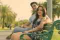 Young Hispanic couple relaxing in the park together Royalty Free Stock Photo