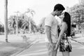 Young Hispanic couple relaxing in the park together Royalty Free Stock Photo