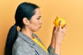 Young hispanic girl looking to piggy bank depressed and worry for distress, crying angry and afraid Royalty Free Stock Photo