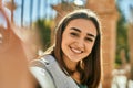 Young hispanic girl smiling happy making selfie by the camera at the city Royalty Free Stock Photo