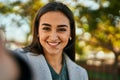 Young hispanic girl smiling happy making selfie by the camera at the city Royalty Free Stock Photo