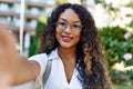 Young hispanic girl smiling happy making selfie by the camera at the city Royalty Free Stock Photo