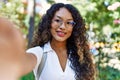 Young hispanic girl smiling happy making selfie by the camera at the city Royalty Free Stock Photo