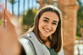 Young hispanic girl smiling happy making selfie by the camera at the city Royalty Free Stock Photo
