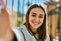 Young hispanic girl smiling happy making selfie by the camera at the city Royalty Free Stock Photo