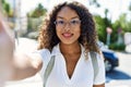 Young hispanic girl smiling happy making selfie by the camera at the city Royalty Free Stock Photo