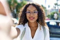 Young hispanic girl smiling happy making selfie by the camera at the city Royalty Free Stock Photo