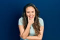 Young hispanic girl wearing casual clothes looking confident at the camera smiling with crossed arms and hand raised on chin Royalty Free Stock Photo