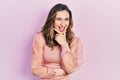 Young hispanic girl wearing casual clothes looking confident at the camera smiling with crossed arms and hand raised on chin Royalty Free Stock Photo