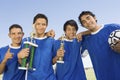 Young Hispanic Latin Football Team With Trophy