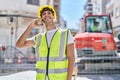 Young hispanic man architect smiling confident talking on smartphone at park Royalty Free Stock Photo