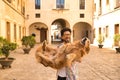 Young Hispanic man with beard and sunglasses holding his dog in his arms very happy. Concept animals, dogs, love, pets, golden Royalty Free Stock Photo