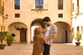 Young Hispanic man with beard and sunglasses hugging his dog standing very happy. Concept animals, dogs, love, pets, golden Royalty Free Stock Photo