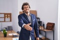 Young hispanic man business worker smiling confident shake hand at office Royalty Free Stock Photo