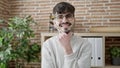 Young hispanic man business worker smiling confident standing at office Royalty Free Stock Photo