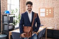 Young hispanic man business worker smiling confident standing at office Royalty Free Stock Photo