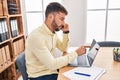 Young hispanic man business worker talking on the smartphone working at office Royalty Free Stock Photo