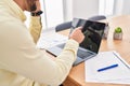 Young hispanic man business worker talking on the smartphone working at office Royalty Free Stock Photo