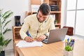 Young hispanic man call center agent working at office Royalty Free Stock Photo