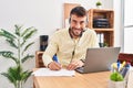 Young hispanic man call center agent working at office Royalty Free Stock Photo