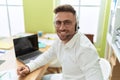 Young hispanic man call center agent working at office Royalty Free Stock Photo