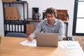 Young hispanic man call center agent working at office Royalty Free Stock Photo