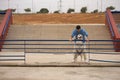 Young Hispanic man, leaning on a railing next to his dog in a funny attitude. Concept, dogs, pets, animals, friends